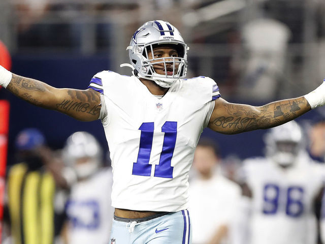 ARLINGTON, TEXAS - DECEMBER 26: Micah Parsons #11 of the Dallas Cowboys celebrates after a sack during the second half against the Washington Football Team at AT&T Stadium on December 26, 2021 in Arlington, Texas.