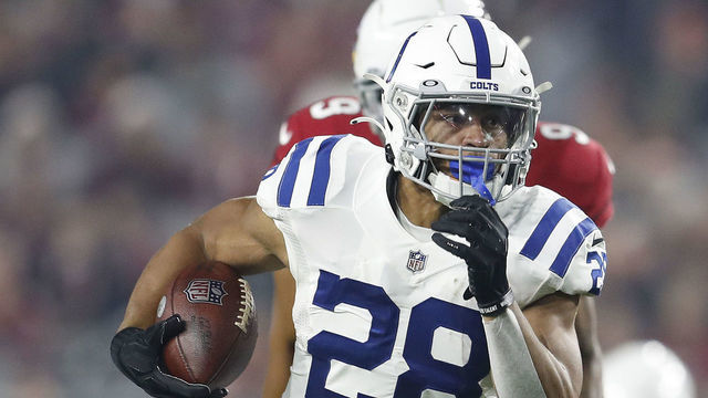 GLENDALE, ARIZONA - DECEMBER 25: Jonathan Taylor #28 of the Indianapolis Colts runs with the ball against the Arizona Cardinals during the first half at State Farm Stadium on December 25, 2021 in Glendale, Arizona.