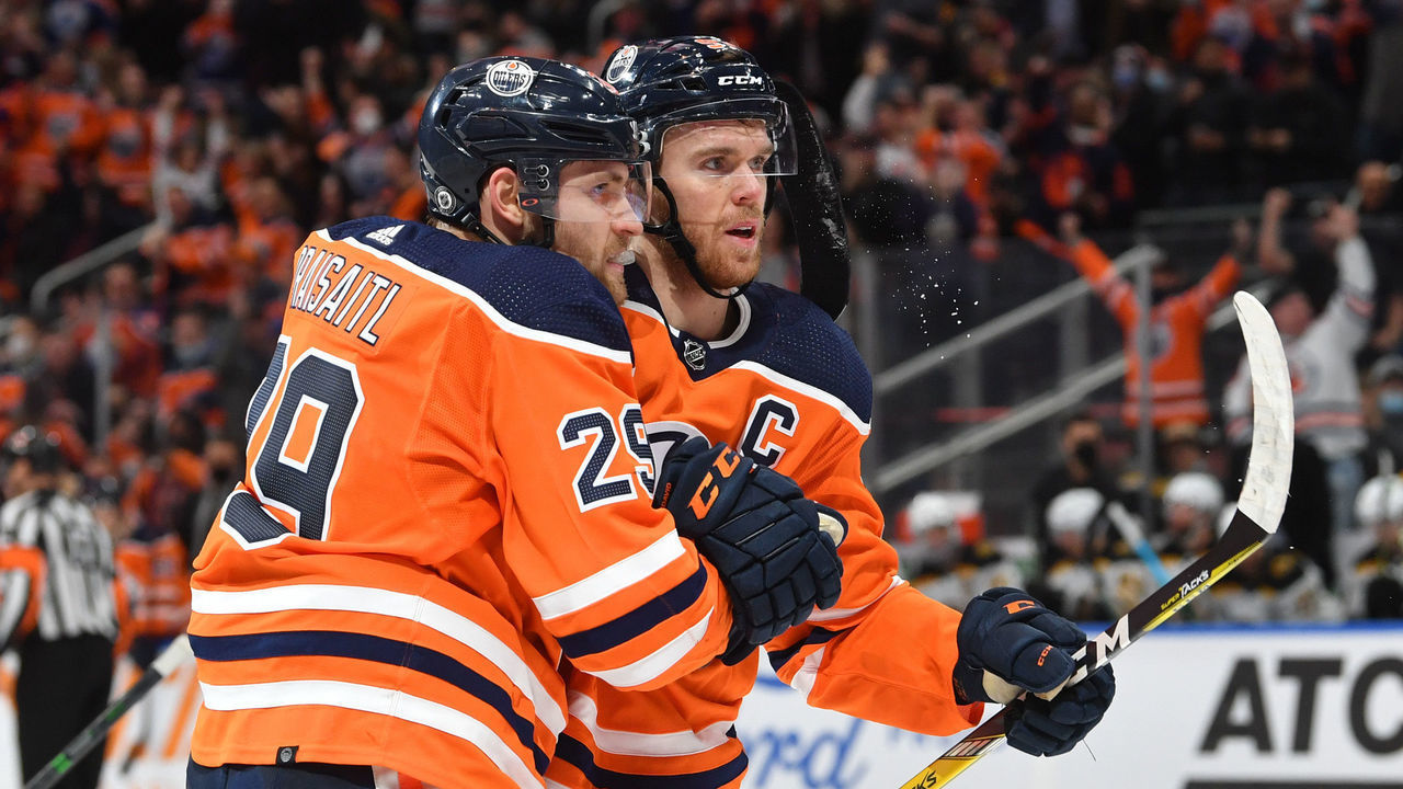 EDMONTON, AB - DECEMBER 9: Leon Draisaitl #29 and Connor McDavid #97 of the Edmonton Oilers celebrate after a goal the game against the Boston Bruins on December 9, 2021 at Rogers Place in Edmonton, Alberta, Canada.
