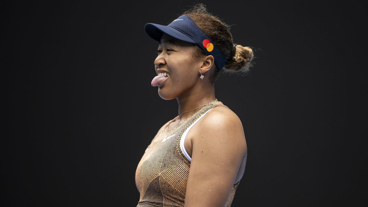 MELBOURNE, AUSTRALIA - JANUARY 04: Naomi Osaka of Japan sticks her tongue out after missing a shot during her match against Alize Cornet of France during the Melbourne Summer Set at Melbourne Park on January 04, 2022 in Melbourne, Australia.