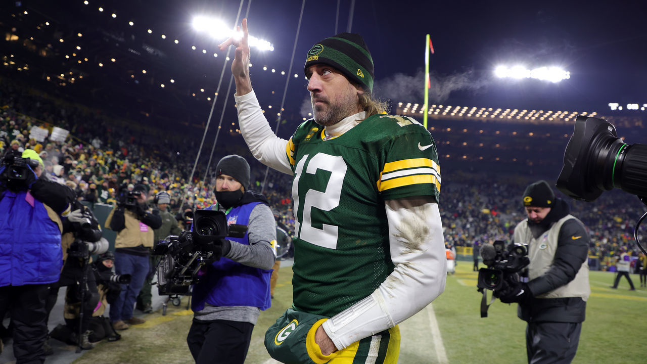 GREEN BAY, WISCONSIN - JANUARY 02: Quarterback Aaron Rodgers #12 of the Green Bay Packers walks off the field after the Packers defeated the Minnesota Vikings 37-10 to win the game at Lambeau Field on January 02, 2022 in Green Bay, Wisconsin.