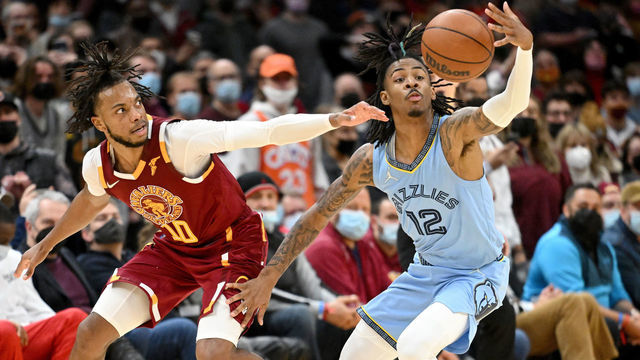 CLEVELAND, OHIO - JANUARY 04: Ja Morant #12 of the Memphis Grizzlies steals the ball from Darius Garland #10 of the Cleveland Cavaliers during the fourth quarter at Rocket Mortgage Fieldhouse on January 04, 2022, in Cleveland, Ohio. The Grizzlies defeated the Cavaliers 110-106. NOTE TO USER: The user expressly acknowledges and agrees that, by downloading and/or using this photograph, the user is consenting to the terms and conditions of the Getty Images License Agreement.