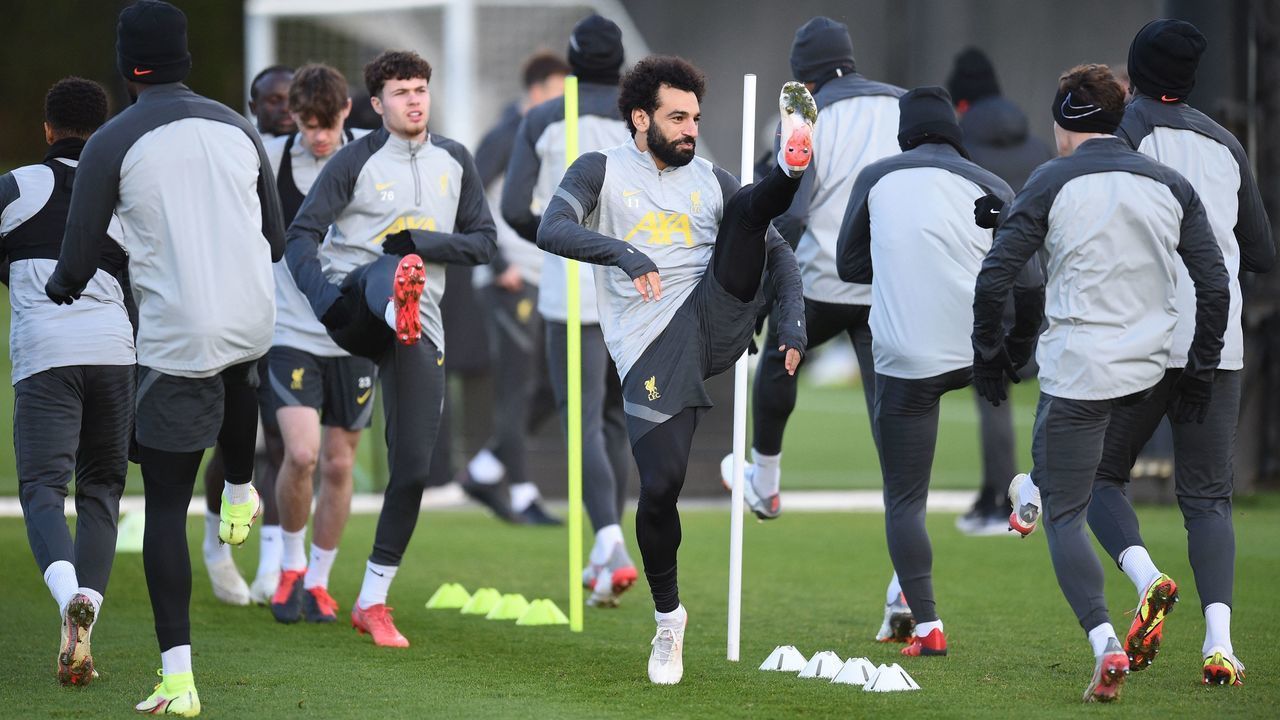 Liverpool's Egyptian midfielder Mohamed Salah (C) warms up with teammates at their training ground in Kirkby, north of Liverpool in northwest England, on December 6, 2021, on the eve of their UEFA Champions League Group B football match against AC Milan.