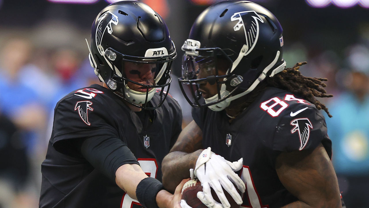 ATLANTA, GA - DECEMBER 26: Matt Ryan #2 of the Atlanta Falcons hands off to Cordarrelle Patterson #84 against the Detroit Lions at Mercedes-Benz Stadium on December 26, 2021 in Atlanta, Georgia.
