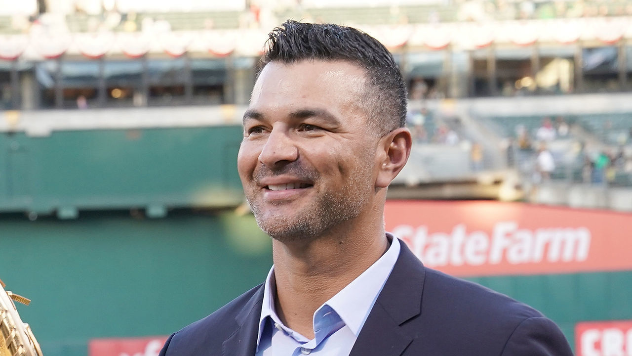OAKLAND, CA - MARCH 29: Matt Olson #28 of the Oakland Athletics is presented with his Rawlings 2018 Gold Glove Award by former Oakland Athletics gold glover Eric Chavez prior to the start of his game against the Los Angeles Angels of Anaheim at Oakland-Alameda County Coliseum on March 29, 2019 in Oakland, California.