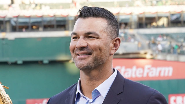 OAKLAND, CA - MARCH 29: Matt Olson #28 of the Oakland Athletics is presented with his Rawlings 2018 Gold Glove Award by former Oakland Athletics gold glover Eric Chavez prior to the start of his game against the Los Angeles Angels of Anaheim at Oakland-Alameda County Coliseum on March 29, 2019 in Oakland, California.