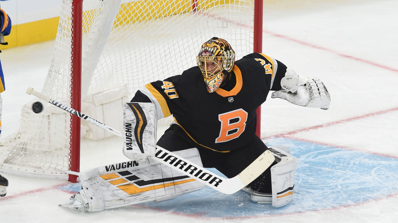 BOSTON, MA - APRIL 29: Tuukka Rask #40 of the Boston Bruins deflects the puck against the Buffalo Sabres at the TD Garden on April 29, 2021 in Boston, Massachusetts.