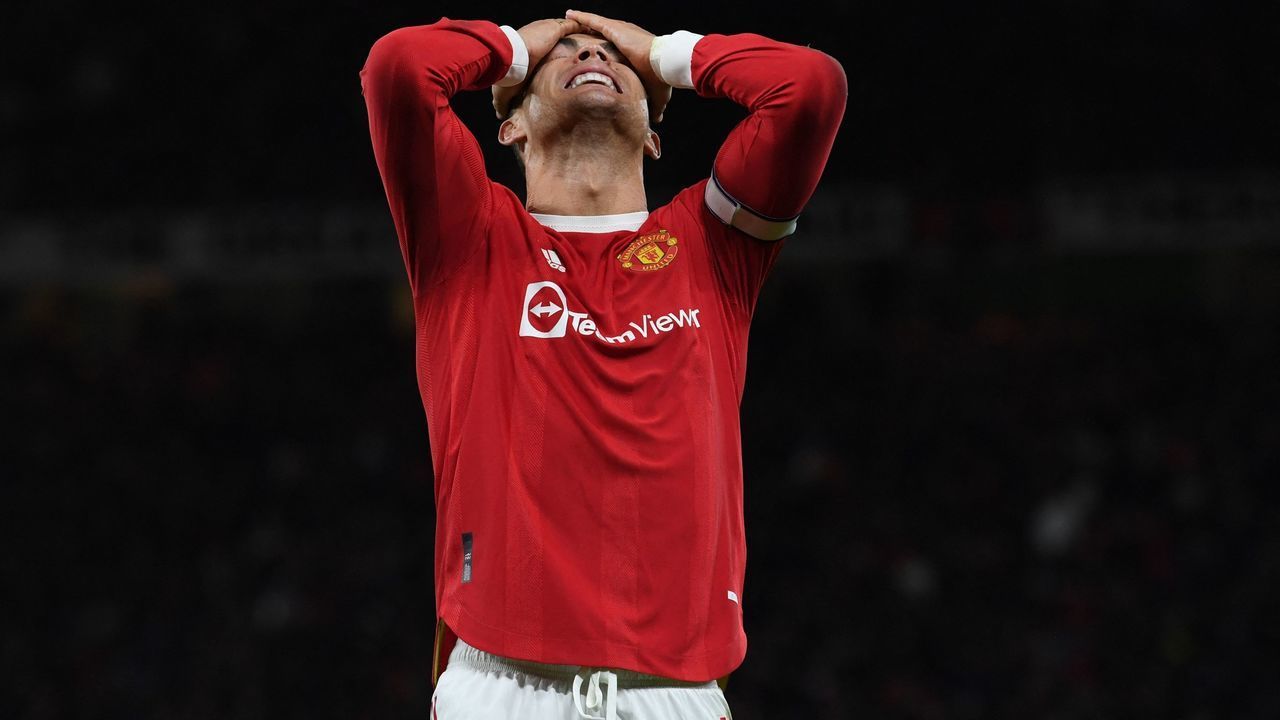 Manchester United's Portuguese striker Cristiano Ronaldo reacts to a missed chance during the English Premier League football match between Manchester United and Wolverhampton Wanderers at Old Trafford in Manchester, north west England, on January 3, 2022. - RESTRICTED TO EDITORIAL USE. No use with unauthorized audio, video, data, fixture lists, club/league logos or 'live' services. Online in-match use limited to 120 images. An additional 40 images may be used in extra time. No video emulation. Social media in-match use limited to 120 images. An additional 40 images may be used in extra time. No use in betting publications, games or single club/league/player publications.