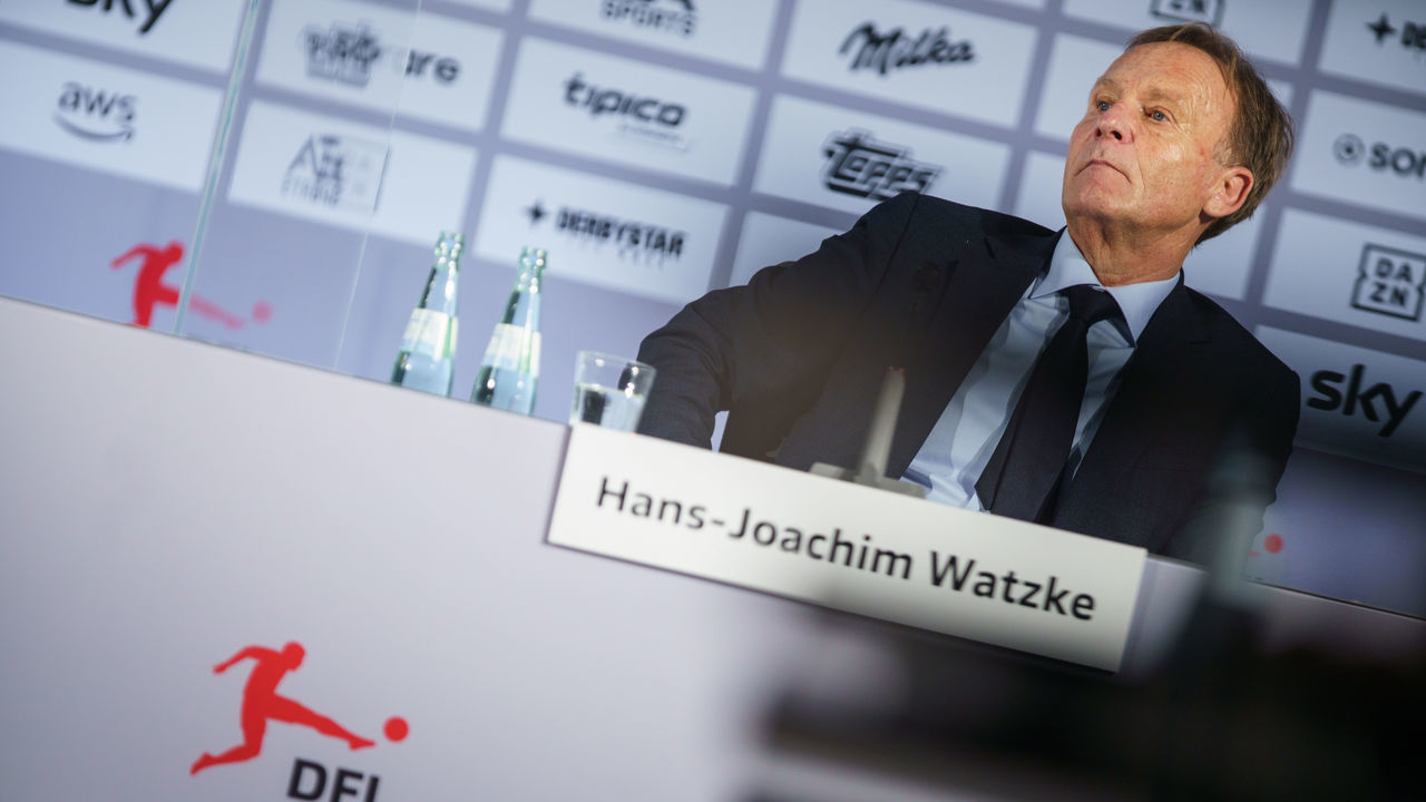 14 December 2021, Hessen, Frankfurt/Main: Hans-Joachim Watzke, the designated chairman of the supervisory board of the German Football League (DFL), sits on the podium at a press conference following the DFL general meeting, at which the course was set for the future in terms of content and personnel. Photo: Frank Rumpenhorst/dpa