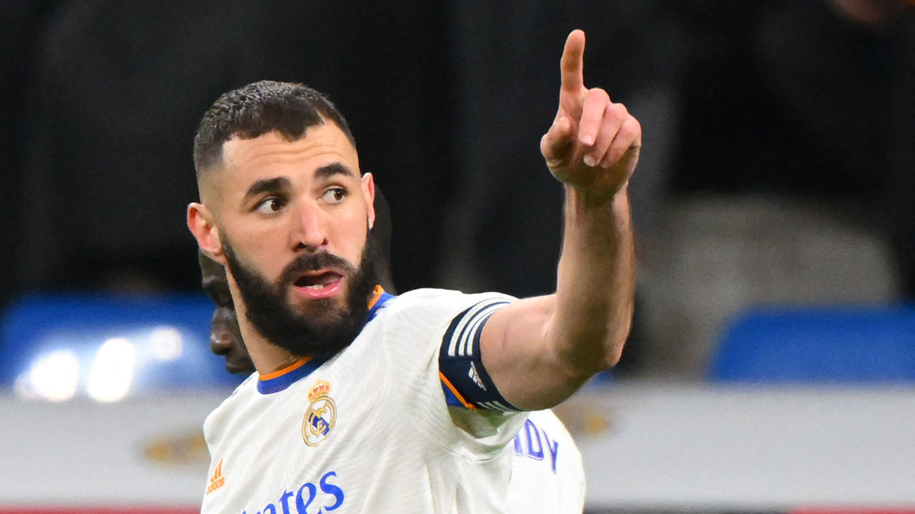 Real Madrid's French forward Karim Benzema celebrates scoring his team's fourth goal during the Spanish league football match between Real Madrid CF and Valencia CF at the Santiago Bernabeu stadium in Madrid on January 8, 2022.