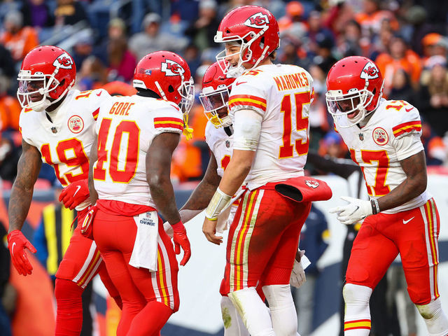 DENVER, COLORADO - JANUARY 08: Patrick Mahomes #15 of the Kansas City Chiefs celebrates with teammates following a touchdown during the second half against the Denver Broncos at Empower Field At Mile High on January 08, 2022 in Denver, Colorado.