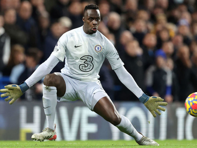 LONDON, ENGLAND - JANUARY 02: Chelsea goalkeeper Edouard Mendy spreads his body to successfully save a shot from Mohamed Salah of Liverpool during the Premier League match between Chelsea and Liverpool at Stamford Bridge on January 2, 2022 in London, England.