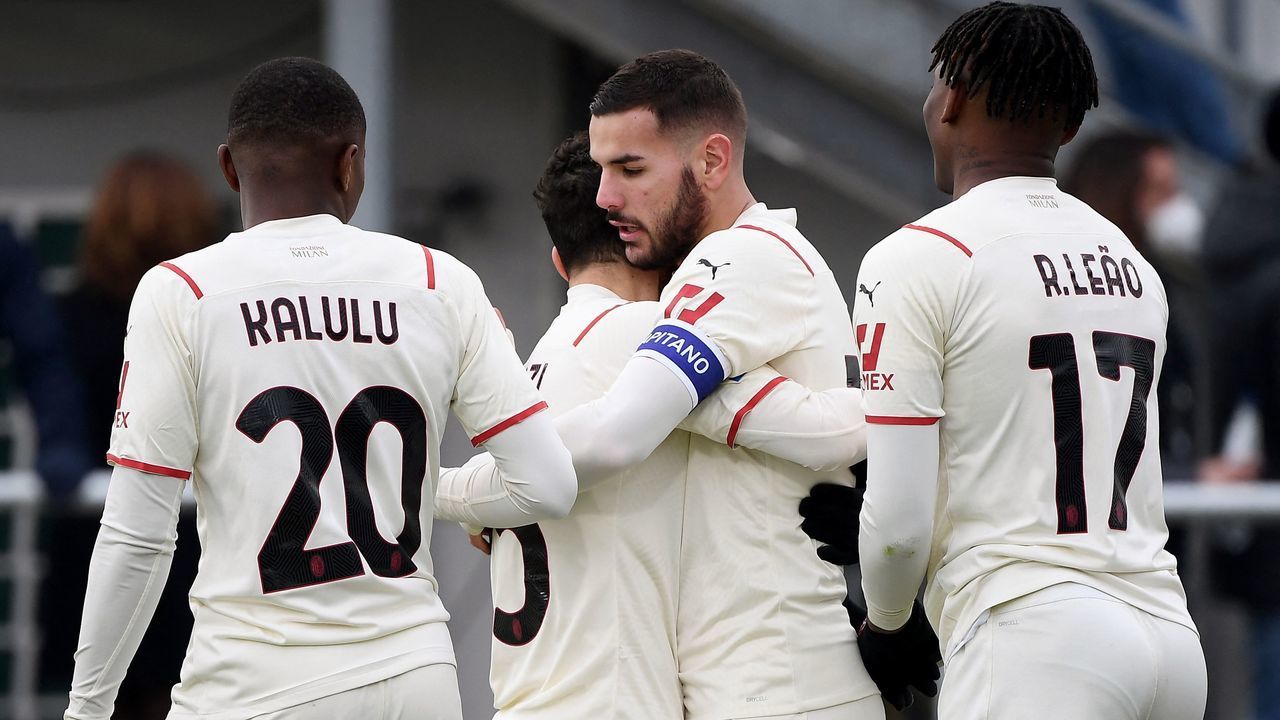 AC Milan's French defender Theo Hernandez (C) celebrates with teammates after scoring during the Serie A football match beetween Venezia and AC Milan at the Pier Luigi Penso stadium in Venice on January 9, 2022.