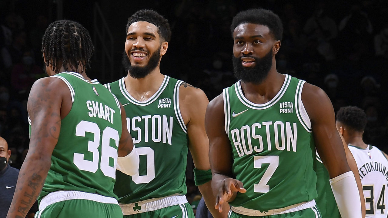 BOSTON, MA - DECEMBER 13: Jayson Tatum #0 of the Boston Celtics, Marcus Smart #36 of the Boston Celtics, and Jaylen Brown #7 of the Boston Celtics celebrate against the Milwaukee Bucks on December 13, 2021 at the TD Garden in Boston, Massachusetts. Mandatory Copyright Notice: Copyright 2021 NBAE