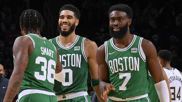 BOSTON, MA - DECEMBER 13: Jayson Tatum #0 of the Boston Celtics, Marcus Smart #36 of the Boston Celtics, and Jaylen Brown #7 of the Boston Celtics celebrate against the Milwaukee Bucks on December 13, 2021 at the TD Garden in Boston, Massachusetts. Mandatory Copyright Notice: Copyright 2021 NBAE