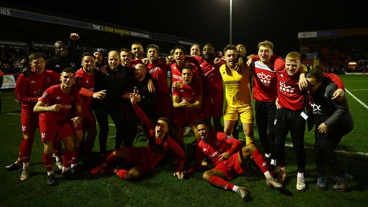 KIDDERMINSTER, ENGLAND - JANUARY 08: Players of Kidderminster Harriers celebrate following the Emirates FA Cup Third Round match between Kidderminster Harriers and Reading at Aggborough Stadium on January 08, 2022 in Kidderminster, England.