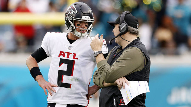 JACKSONVILLE, FLORIDA - NOVEMBER 28: Matt Ryan #2 and head coach Arthur Smith of the Atlanta Falcons talk on the side line during the fourth quarter against the Jacksonville Jaguars at TIAA Bank Field on November 28, 2021 in Jacksonville, Florida.