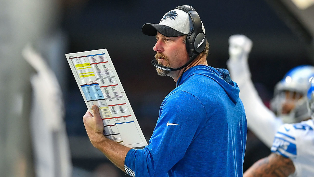 ATLANTA, GA DECEMBER 26: Detroit head coach Dan Campbell looks at his play sheet on the sideline during the NFL game between the Detroit Lions and the Atlanta Falcons on December 26th, 2021 at Mercedes-Benz Stadium in Atlanta, GA.