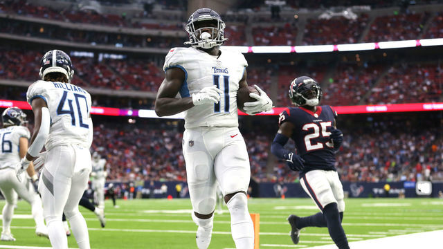 HOUSTON, TEXAS - JANUARY 09: A.J. Brown #11 of the Tennessee Titans catches the ball for a touchdown during the second quarter against the Houston Texans at NRG Stadium on January 09, 2022 in Houston, Texas.