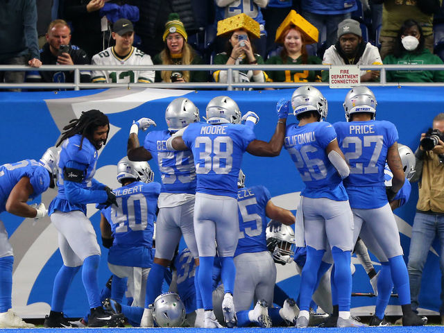 Detroit Lions players celebrate an interception during the second half of an NFL football game against the Green Bay Packers in Detroit, Michigan USA, on Sunday, December 9, 2022.