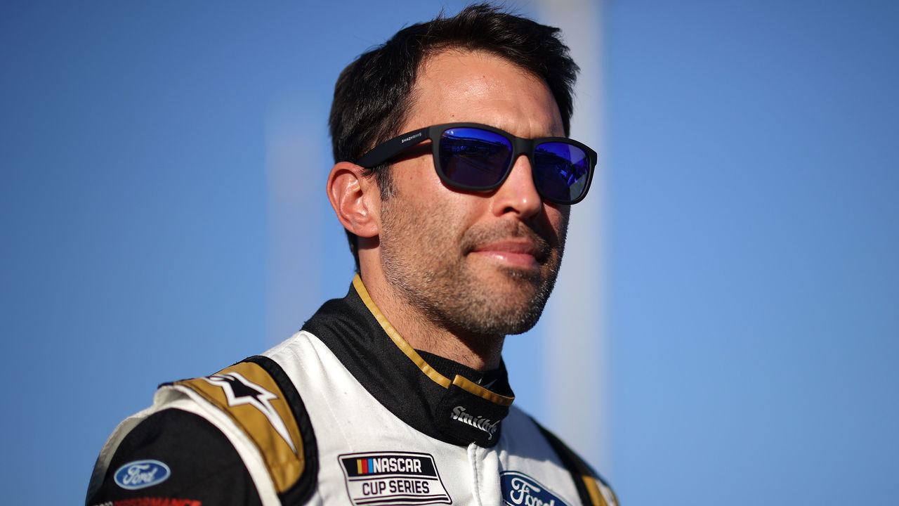 AVONDALE, ARIZONA - NOVEMBER 06: Aric Almirola, driver of the #10 Smithfield Ford, walks the grid during qualifying for the NASCAR Cup Series Championship at Phoenix Raceway on November 06, 2021 in Avondale, Arizona.