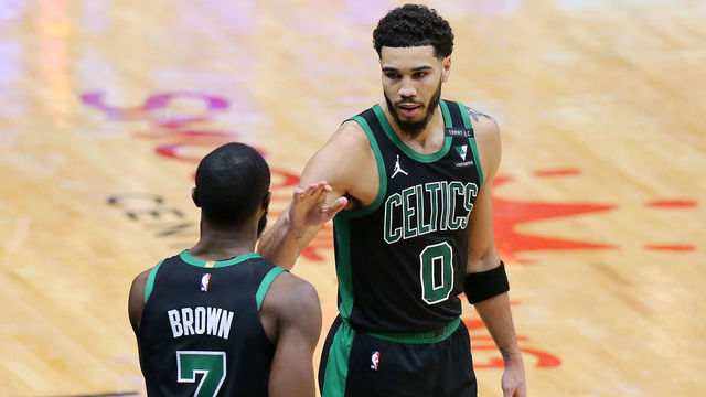 NEW ORLEANS, LOUISIANA - FEBRUARY 21: Jayson Tatum #0 of the Boston Celtics talks to Jaylen Brown #7 against the New Orleans Pelicans during a game at the Smoothie King Center on February 21, 2021 in New Orleans, Louisiana.