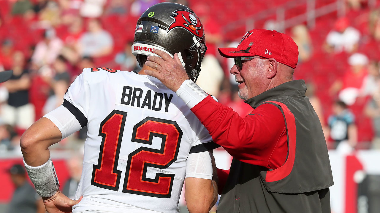 TAMPA, FL - JANUARY 9: Tampa Bay Buccaneers Quarterback Tom Brady (12) greets Head Coach Bruce Arians before the regular season game between the Carolina Panthers and the Tampa Bay Buccaneers on January 9, 2022 at Raymond James Stadium in Tampa, Florida.