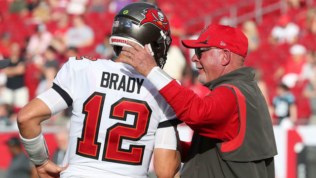 TAMPA, FL - JANUARY 9: Tampa Bay Buccaneers Quarterback Tom Brady (12) greets Head Coach Bruce Arians before the regular season game between the Carolina Panthers and the Tampa Bay Buccaneers on January 9, 2022 at Raymond James Stadium in Tampa, Florida.