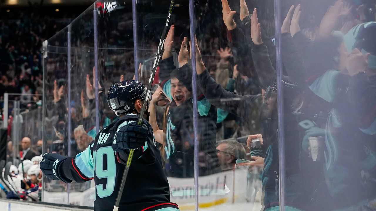 SEATTLE, WASHINGTON - DECEMBER 11: Vince Dunn #29 of the Seattle Kraken celebrates his game tying goal with fans during the third period of a game between the Columbus Blue Jackets and the Seattle Kraken at Climate Pledge Arena on December 11, 2021 in Seattle, Washington.