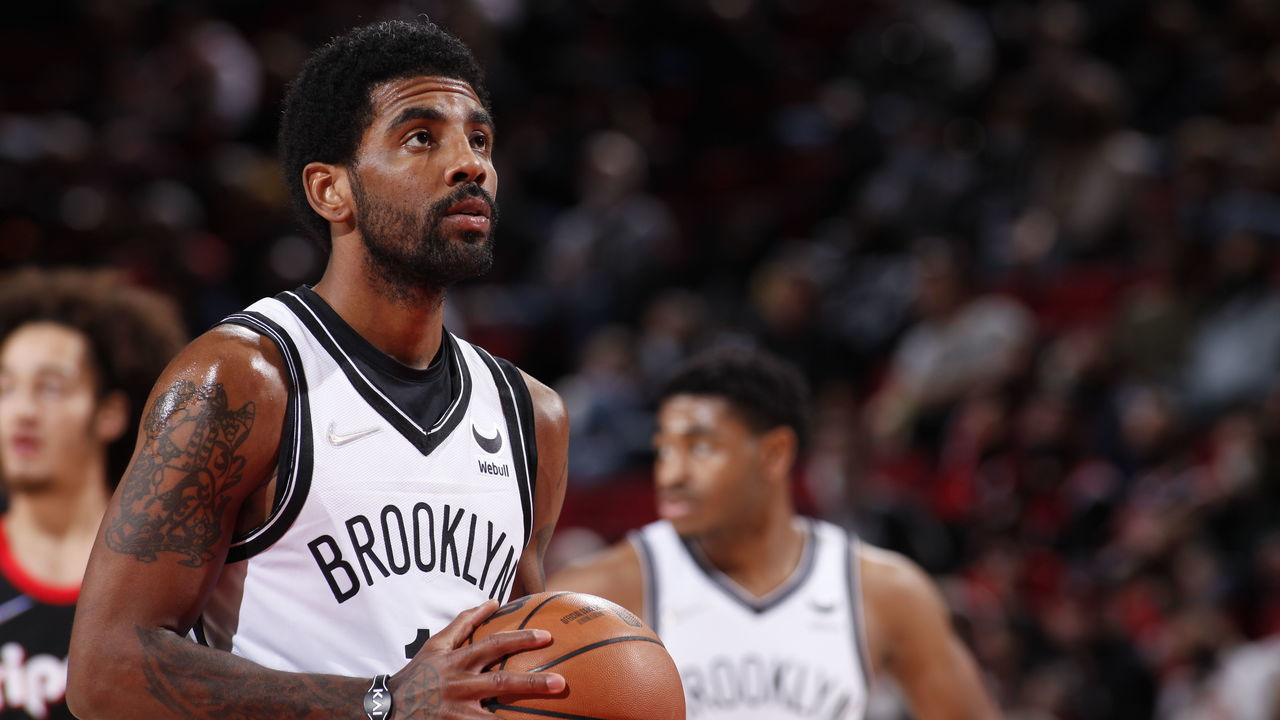 PORTLAND, OR - JANUARY 10: Kyrie Irving #11 of the Brooklyn Nets shoots a free throw during the game against the Portland Trail Blazers on January 10, 2022 at the Moda Center Arena in Portland, Oregon. Mandatory Copyright Notice: Copyright 2022 NBAE