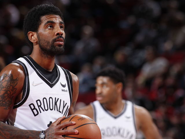 PORTLAND, OR - JANUARY 10: Kyrie Irving #11 of the Brooklyn Nets shoots a free throw during the game against the Portland Trail Blazers on January 10, 2022 at the Moda Center Arena in Portland, Oregon. Mandatory Copyright Notice: Copyright 2022 NBAE