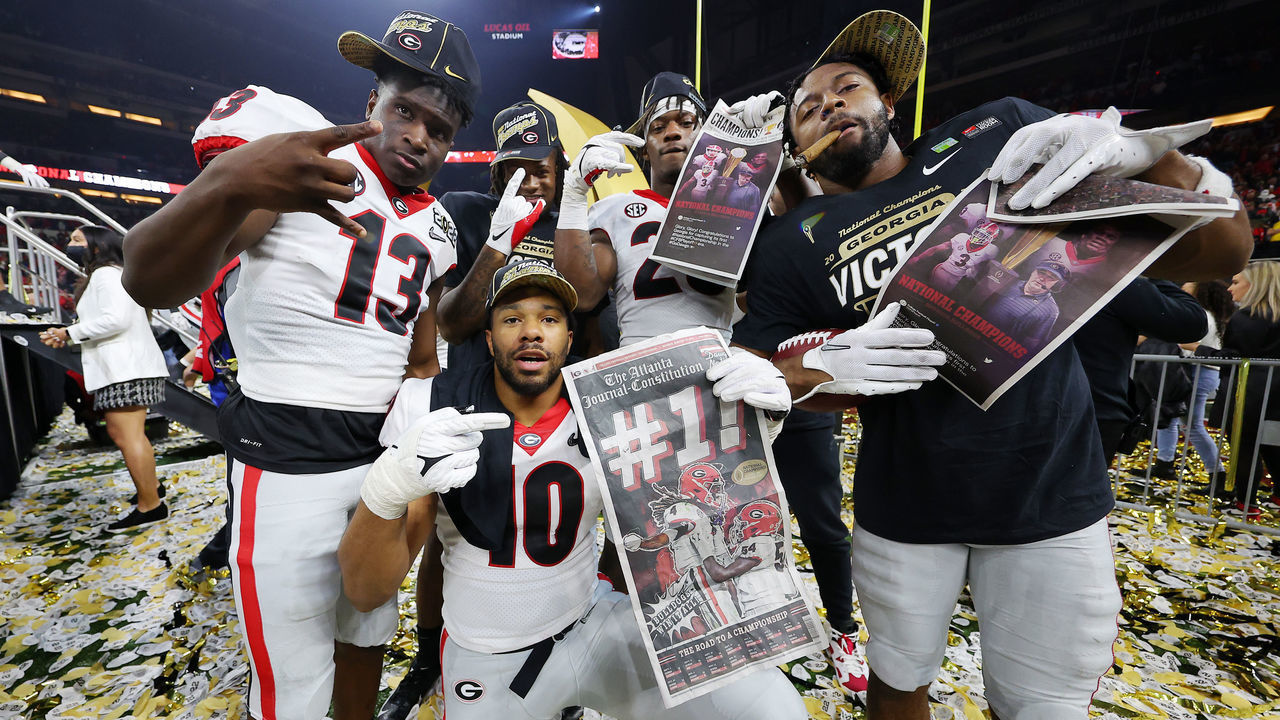 INDIANAPOLIS, INDIANA - JANUARY 10: Georgia Bulldogs players celebrate after the Georgia Bulldogs defeated the Alabama Crimson Tide 33-18 in the 2022 CFP National Championship Game at Lucas Oil Stadium on January 10, 2022 in Indianapolis, Indiana.