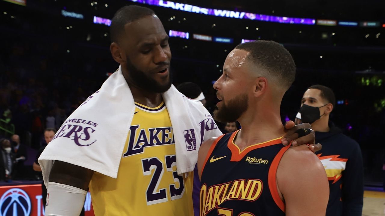 LOS ANGELES, CA - MAY 19: LeBron James #23 of the Los Angeles Lakers talks with Stephen Curry #30 of the Golden State Warriors after the game during the Play-In Tournament on May 19, 2021 at STAPLES Center in Los Angeles, California. NOTE TO USER: User expressly acknowledges and agrees that, by downloading and/or using this photograph, user is consenting to the terms and conditions of the Getty Images License Agreement. Mandatory Copyright Notice: Copyright 2021 NBAE