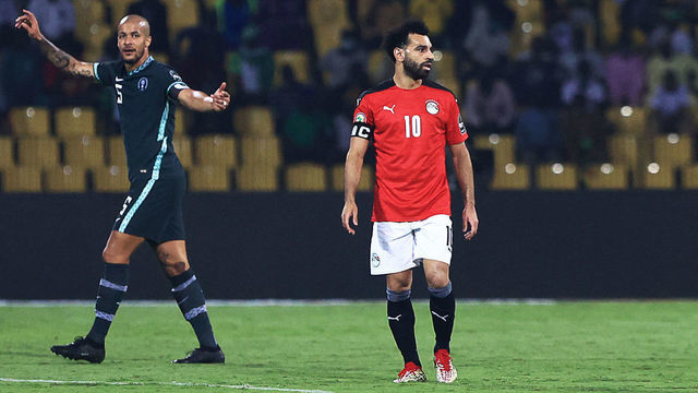 Egypt's forward Mohamed Salah (R) reacts during the Group D Africa Cup of Nations (CAN) 2021 football match between Nigeria and Egypt at Stade Roumde Adjia in Garoua on January 11, 2022.