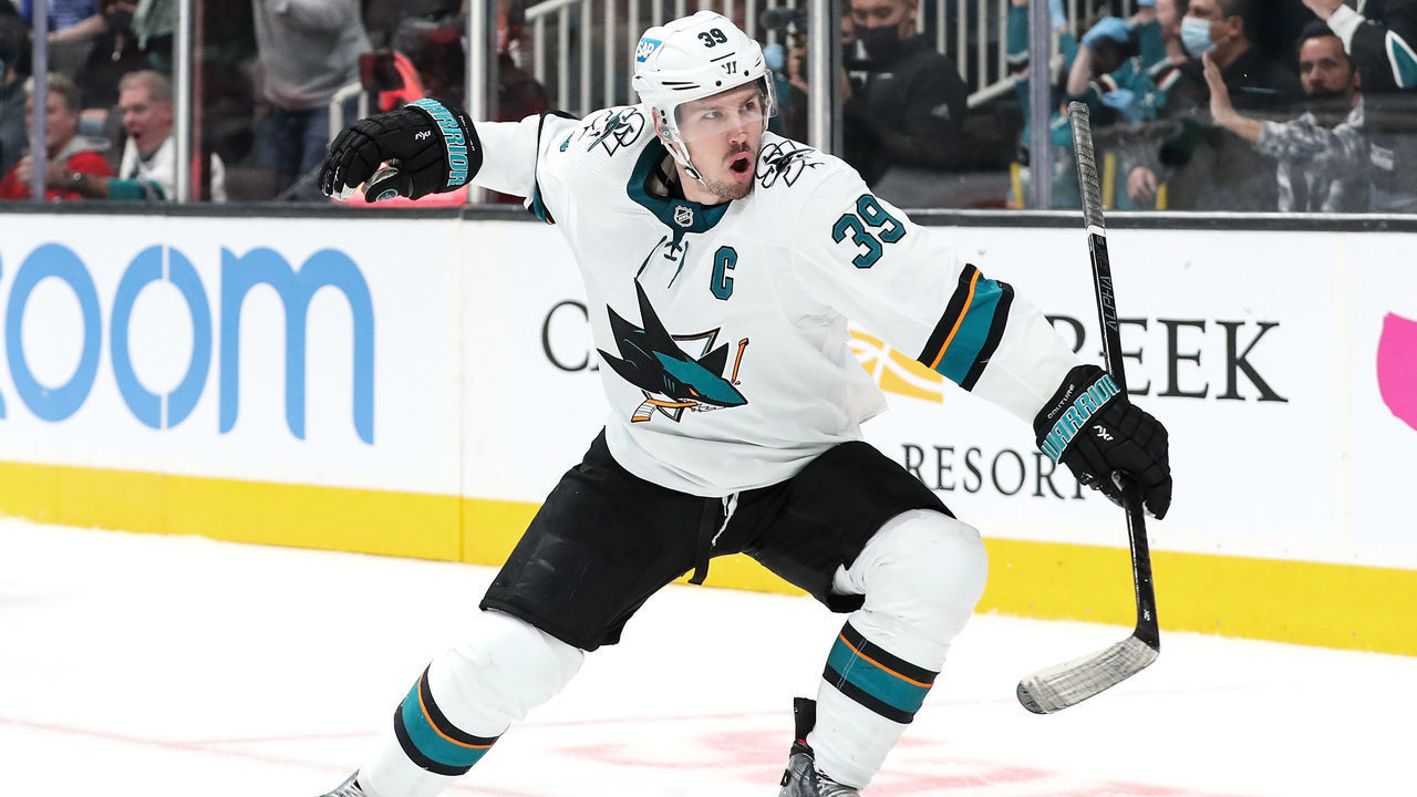 SAN JOSE, CA - JANUARY 11: Logan Couture #39 of the San Jose Sharks celebrates scoring the game-winning goal in overtime against the Detroit Red Wings at SAP Center on January 11, 2022 in San Jose, California.