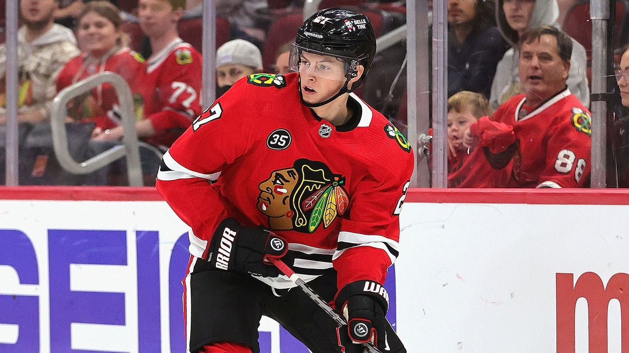 CHICAGO, ILLINOIS - OCTOBER 01: Lukas Reichel #27 of the Chicago Blackhawks looks to pass against the St. Louis Blues during a preseason game at the United Center on October 01, 2021 in Chicago, Illinois.
