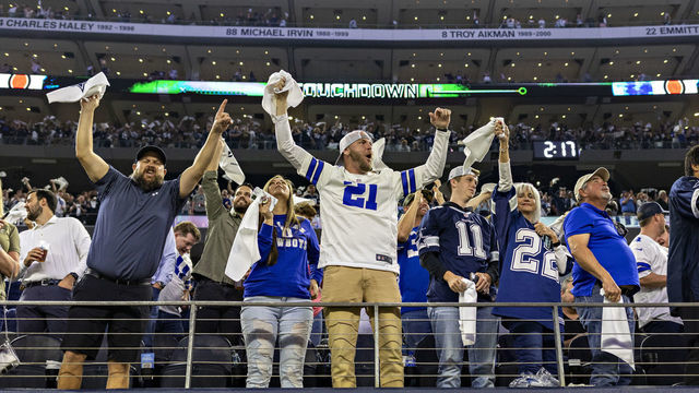 ARLINGTON, TEXAS - DECEMBER 26: Fans of the Dallas Cowboys celebrate after a touchdown during a game against the Washington Football Team at AT&T Stadium on December 26, 2021 in Arlington, Texas. The Cowboys defeated the Football Team 56-14.