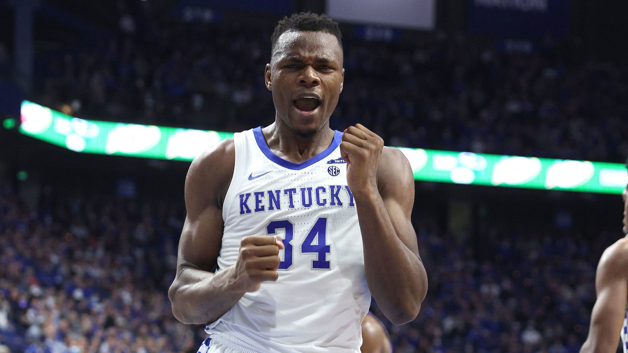 LEXINGTON, KENTUCKY - DECEMBER 31: Oscar Tshiebwe #34 of the Kentucky Wildcats celebrates during the 92-48 win against the High Point Panthers at Rupp Arena on December 31, 2021 in Lexington, Kentucky.