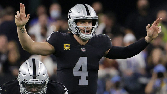 LAS VEGAS, NEVADA - JANUARY 09: Quarterback Derek Carr #4 of the Las Vegas Raiders gestures behind guard Alex Leatherwood #70 at the line of scrimmage during their game against the Los Angeles Chargers at Allegiant Stadium on January 9, 2022 in Las Vegas, Nevada. The Raiders defeated the Chargers 35-32 in overtime.