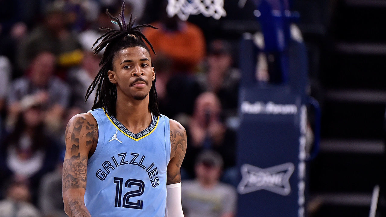 MEMPHIS, TENNESSEE - JANUARY 11: Ja Morant #12 of the Memphis Grizzlies reacts during the game against the Golden State Warriors at FedExForum on January 11, 2022 in Memphis, Tennessee. NOTE TO USER: User expressly acknowledges and agrees that, by downloading and or using this photograph, User is consenting to the terms and conditions of the Getty Images License Agreement.