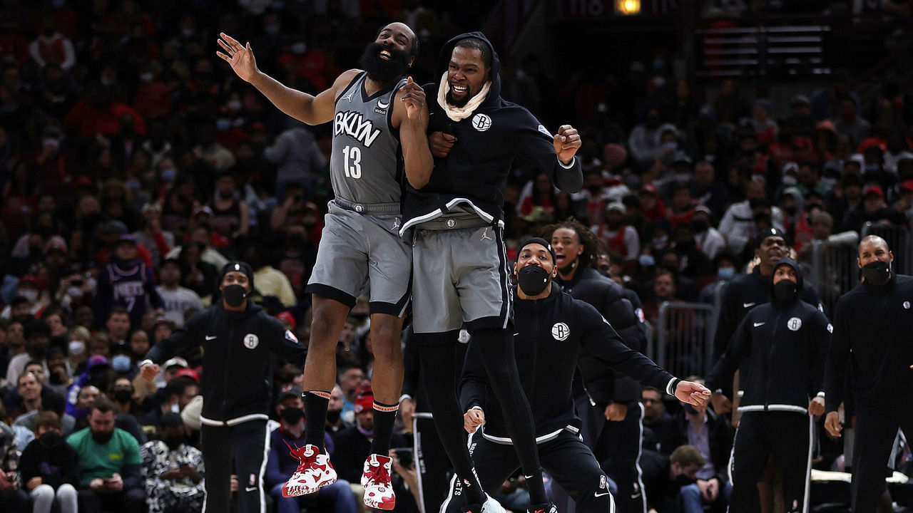 CHICAGO, ILLINOIS - JANUARY 12: James Harden #13 and Kevin Durant #7 of the Brooklyn Nets celebrate after a score during the second half of a game against the Chicago Bulls at United Center on January 12, 2022 in Chicago, Illinois.