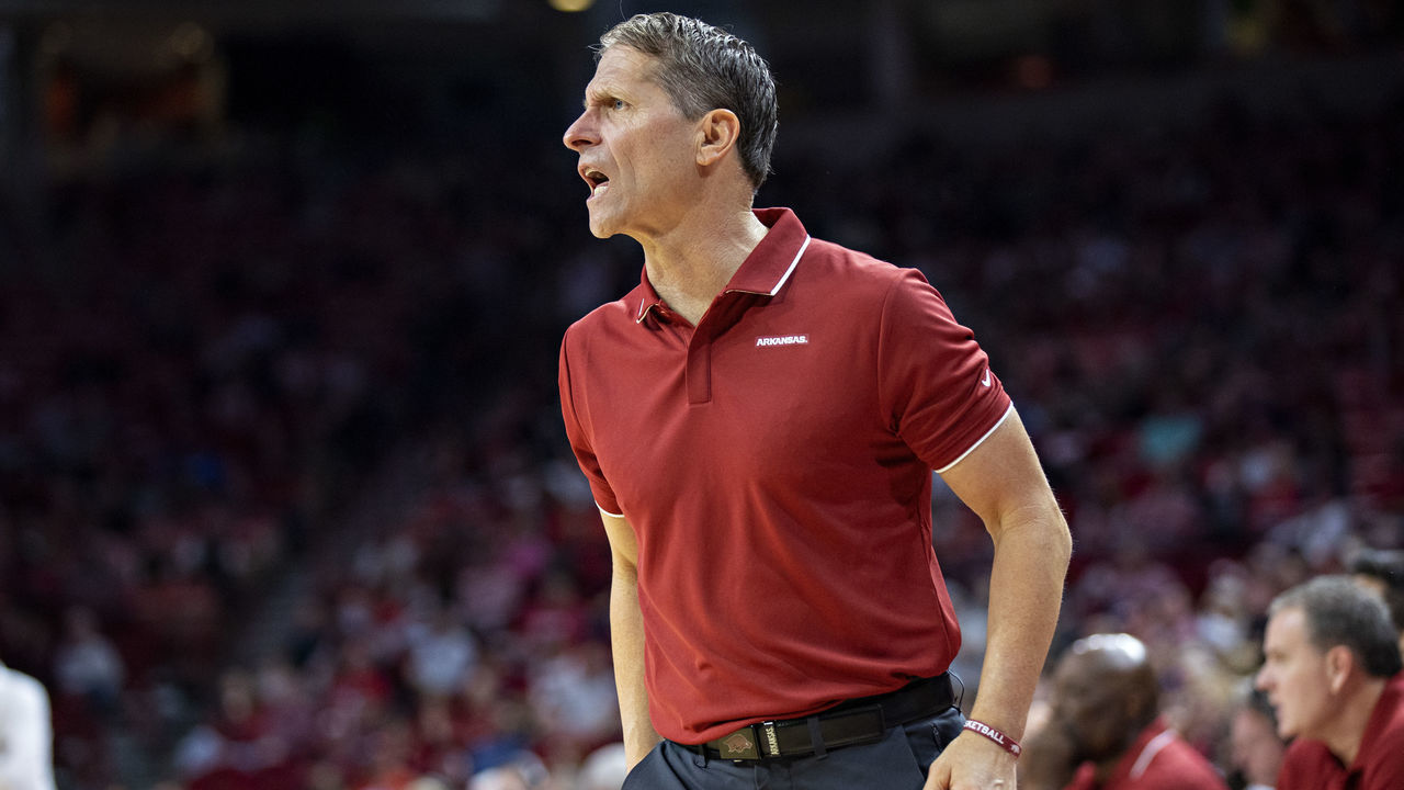 FAYETTEVILLE, ARKANSAS - DECEMBER 04: Head Coach Eric Musselman of the Arkansas Razorbacks talks to a referee during a game against the Little Rock Trojans at Bud Walton Arena on December 4, 2021 in Fayetteville, Arkansas.The Razorbacks defeated the Trojans 93-78,