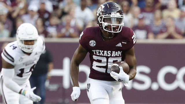 COLLEGE STATION, TEXAS - OCTOBER 02: Isaiah Spiller #28 of the Texas A&M Aggies rushes past Collin Duncan #19 of the Mississippi State Bulldogs for 41 yards at Kyle Field on October 02, 2021 in College Station, Texas.