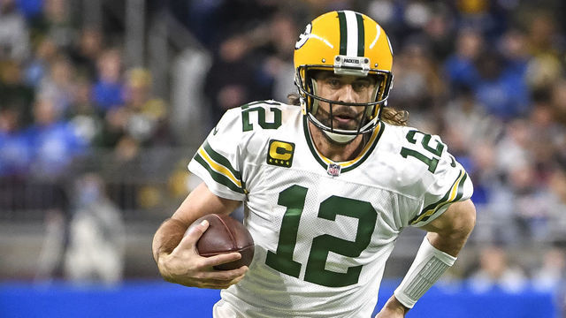 DETROIT, MICHIGAN - JANUARY 09: Aaron Rodgers #12 of the Green Bay Packers runs the ball against the Detroit Lions at Ford Field on January 09, 2022 in Detroit, Michigan.