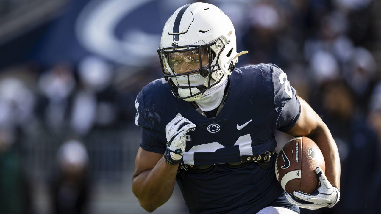 STATE COLLEGE, PA - NOVEMBER 20: Noah Cain #21 of the Penn State Nittany Lions warms up before the game against the Rutgers Scarlet Knights at Beaver Stadium on November 20, 2021 in State College, Pennsylvania.