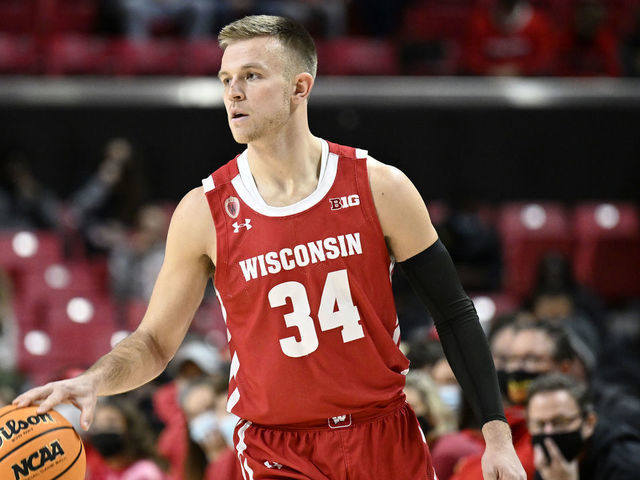COLLEGE PARK, MARYLAND - JANUARY 09: Brad Davison #34 of the Wisconsin Badgers handles the ball against the Maryland Terrapins at Xfinity Center on January 09, 2022 in College Park, Maryland.