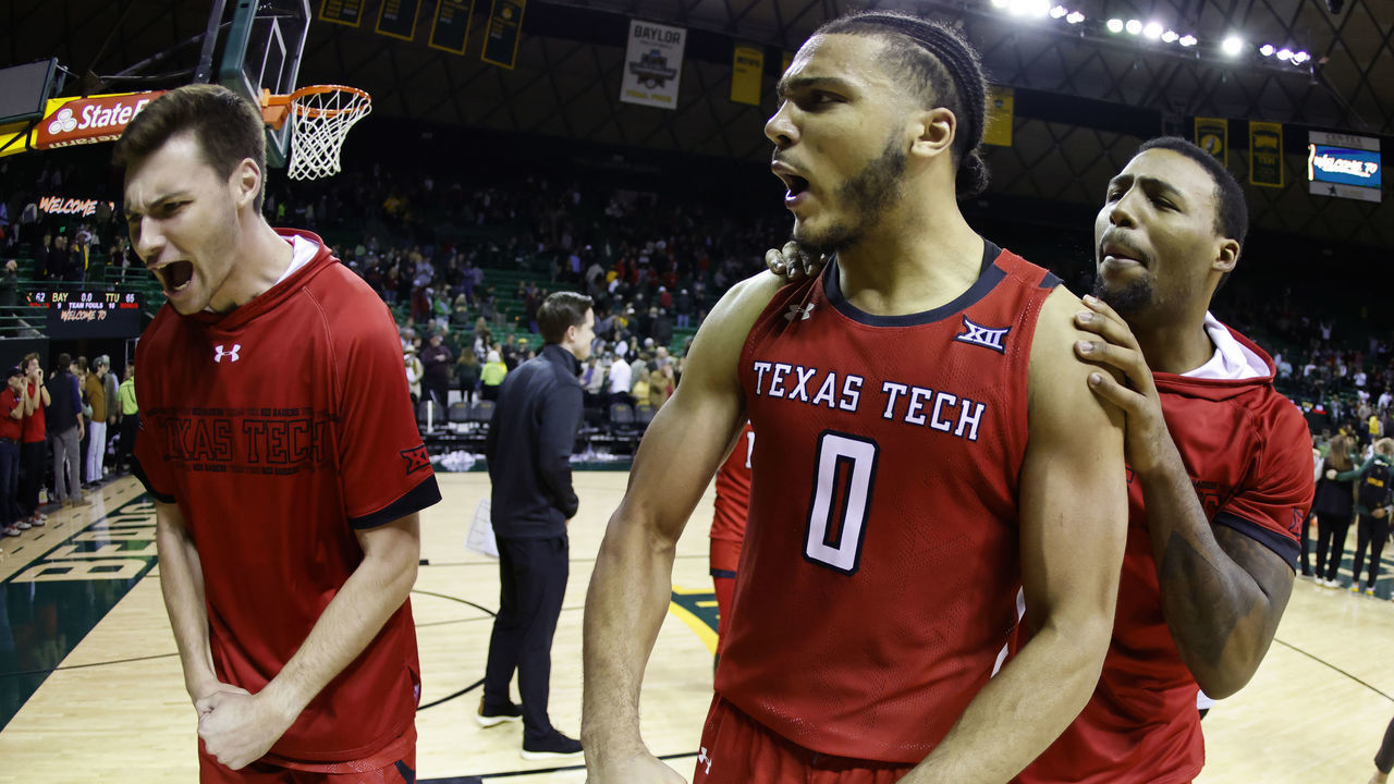 WACO, TX - JANUARY 11: Kevin Obanor #0 of the Texas Tech Red Raiders celebrates with teammates following Techs 65-62 win over the Baylor Bears at the Ferrell Center on January 11, 2022 in Waco, Texas.