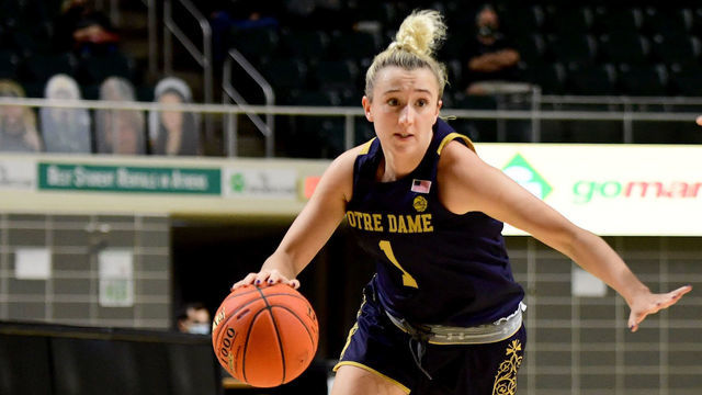 ATHENS, OHIO - NOVEMBER 27: Dara Mabrey #1 of the Notre Dame Fighting Irish drives the ball past Peyton Guice #11 of the Ohio Bobcats during their game at the Ohio University Convocation Center on November 27, 2020 in Athens, Ohio. Ohio won 86-85.