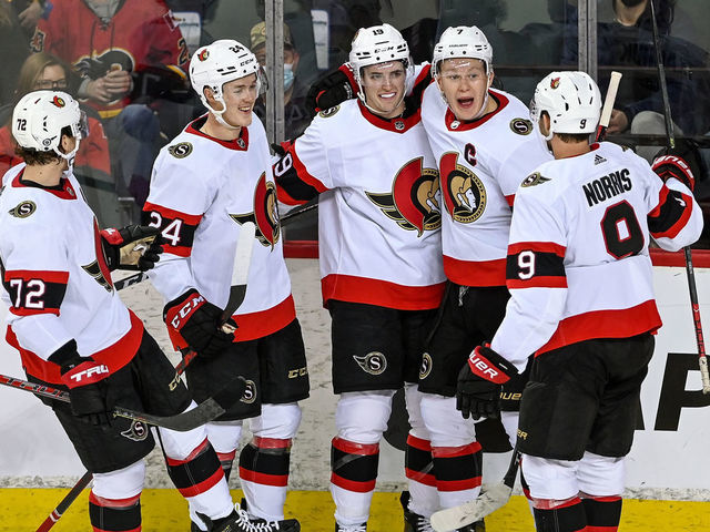CALGARY, AB - JANUARY 13: Ottawa Senators Right Wing Drake Batherson (19) celebrates after scoring a goal with Ottawa Senators Left Wing Brady Tkachuk (7), Ottawa Senators Defenceman Jacob Bernard-Docker (24), Ottawa Senators Defenceman Thomas Chabot (72) and Ottawa Senators Center Josh Norris (9) during the second period of an NHL game where the Calgary Flames hosted the Ottawa Senators on January 13, 2022, at the Scotiabank Saddledome in Calgary, AB.