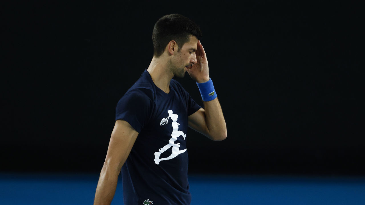 MELBOURNE, AUSTRALIA - JANUARY 14: Novak Djokovic of Serbia reacts during a practice session ahead of the 2022 Australian Open at Melbourne Park on January 14, 2022 in Melbourne, Australia.